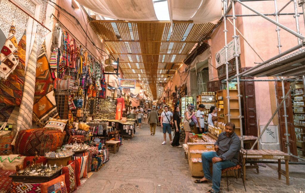 handwoven Moroccan rug in Marrakech souk” or “artisan crafting leather in Marrakech
